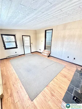 a view of a hallway view with staircase