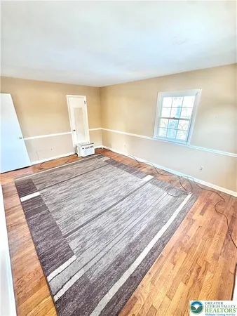 a bathroom with a sink a toilet a mirror and shower