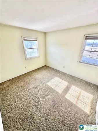 a view of an empty room and window