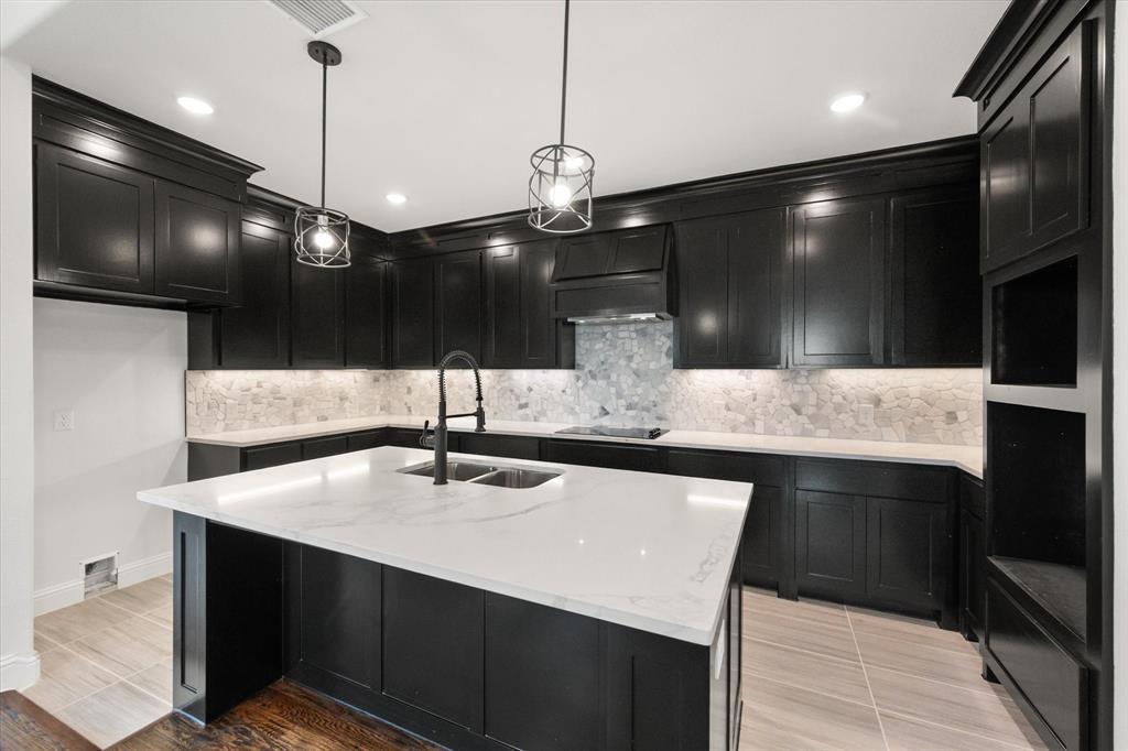 3400 Dobbins Road Corsicana, TX 75110 - Photo 12 of 40 a kitchen with a sink a center island and stainless steel appliances