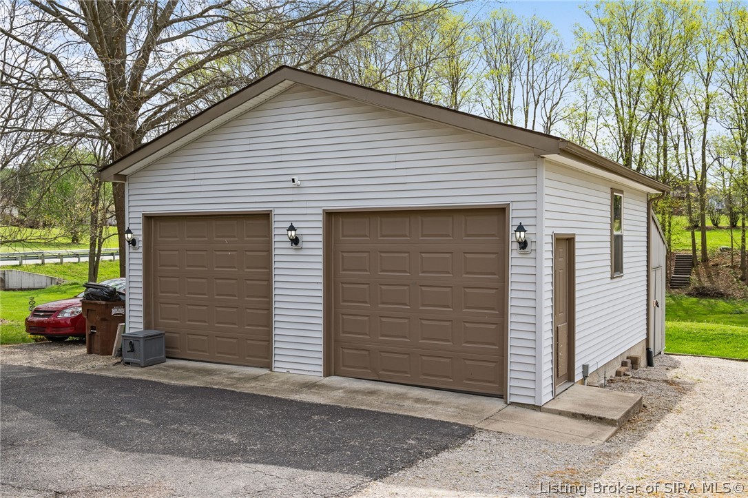 7002 Bethany Road Charlestown, IN 47111 - Photo 11 of 60 Large 2-car garage/workshop with additional lean-to storage