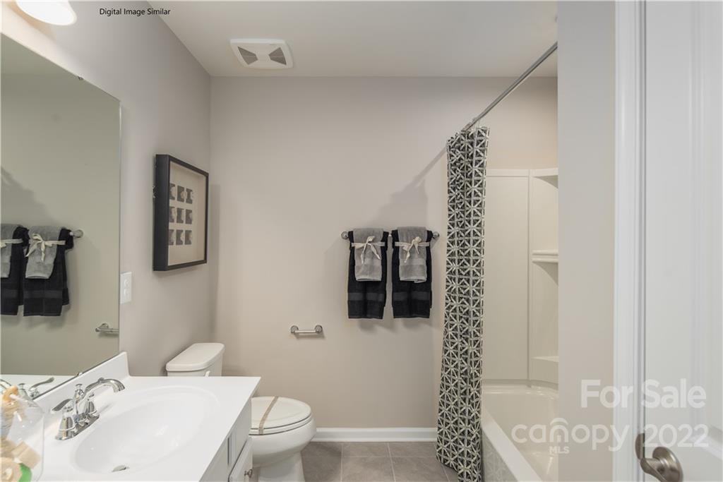 3032 Ballester Road, Unit 250 Indian Land, SC 29707 - Photo 2 of 18 a bathroom with a sink a toilet and shower
