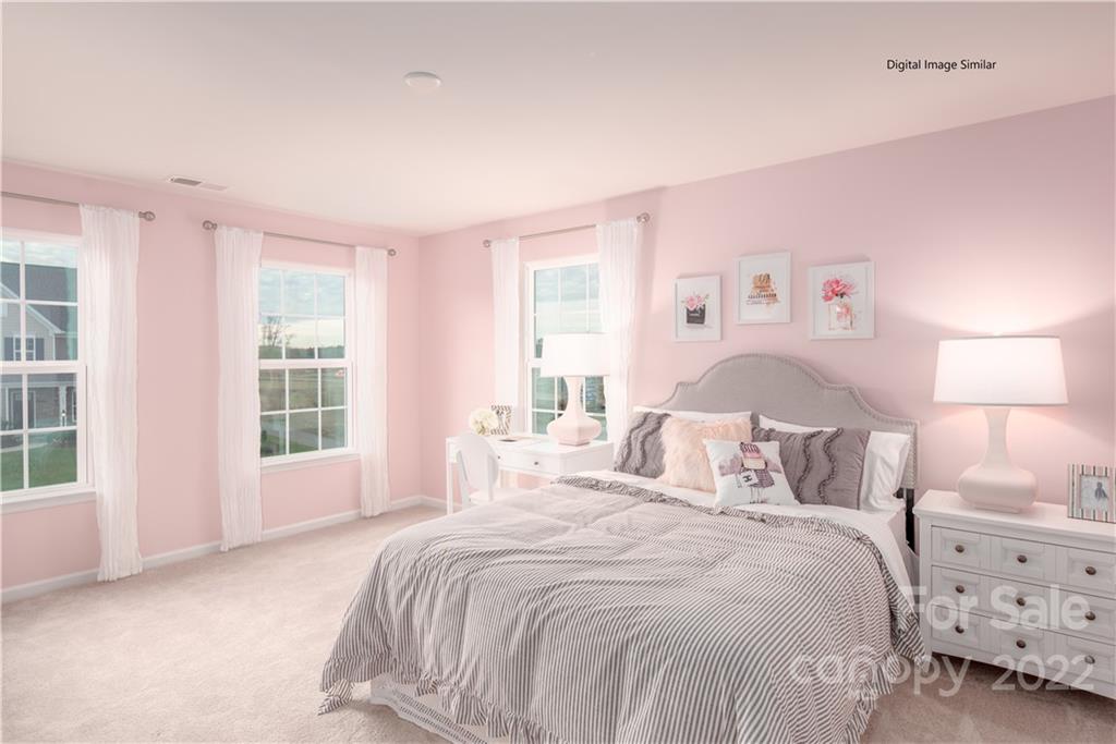 3032 Ballester Road, Unit 250 Indian Land, SC 29707 - Photo 3 of 18 a bedroom with a bed and a window