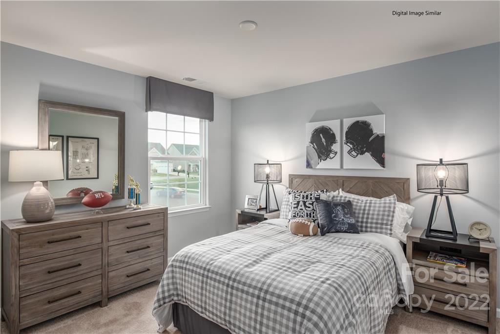 3032 Ballester Road, Unit 250 Indian Land, SC 29707 - Photo 4 of 18 a bedroom with a bed and a window