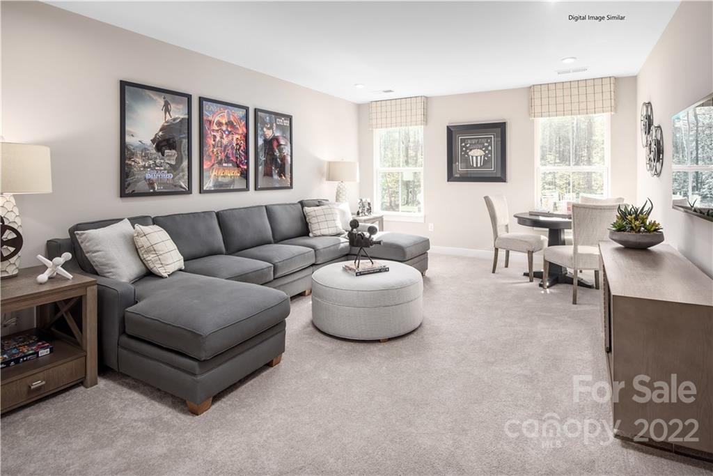 3032 Ballester Road, Unit 250 Indian Land, SC 29707 - Photo 5 of 18 a living room with furniture and a large window
