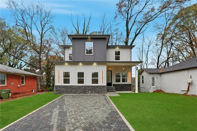 a front view of a house with a yard