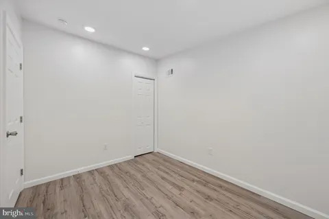 a view of room with wooden floor