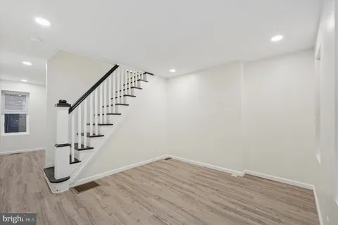 a view of entryway with wooden floor