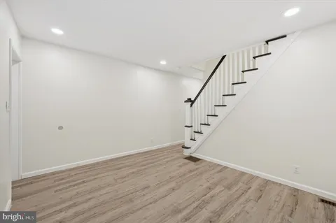 a view of entryway with wooden floor