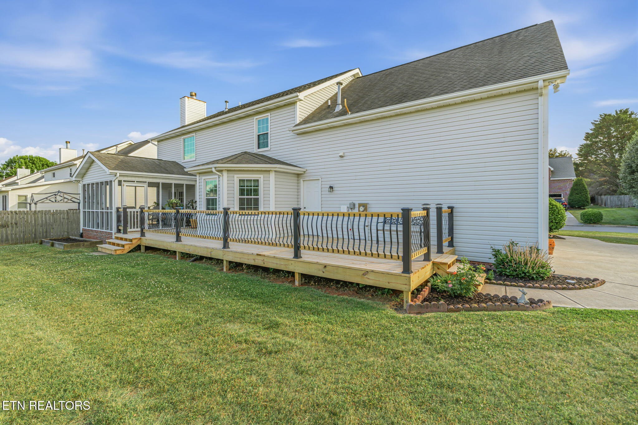 7030 Westerly Winds Road Knoxville, TN 37931 - Photo 36 of 40 a view of a house with a yard and deck