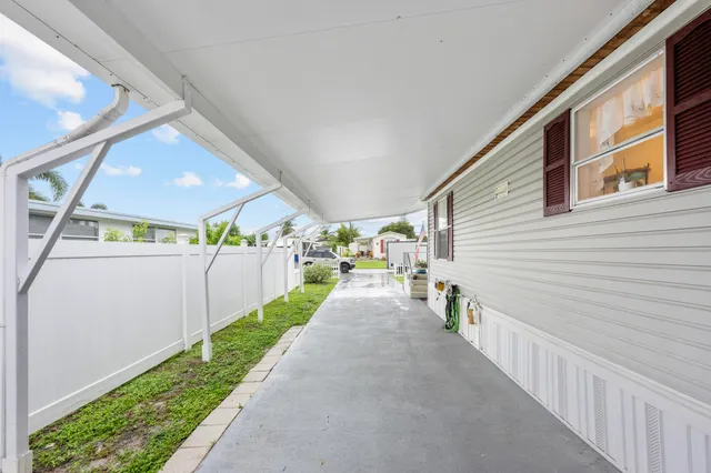 a view of a porch with wooden stairs
