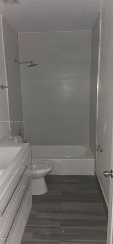 a bathroom with a vanity and mirror
