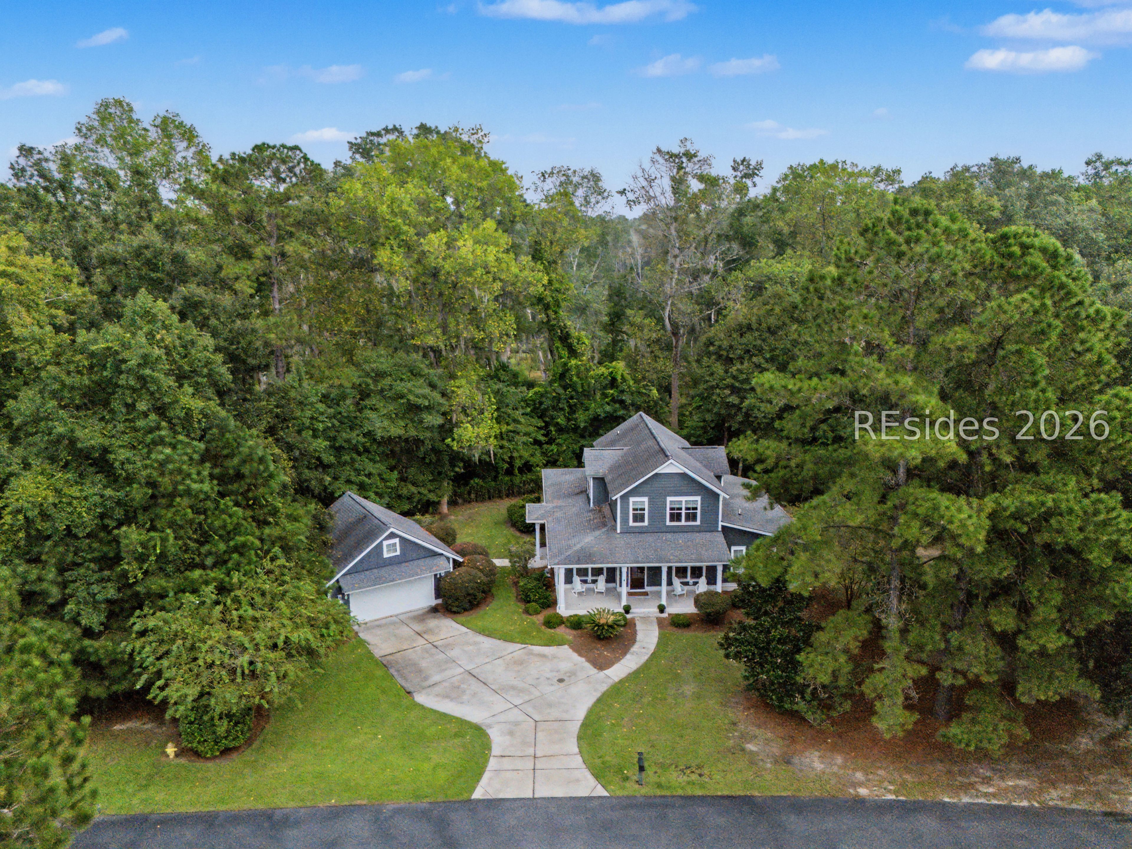 91 Daffodil Farm Road Bluffton, SC 29910 - Photo 3 of 45 Detached 2-car garage surrounded by woods