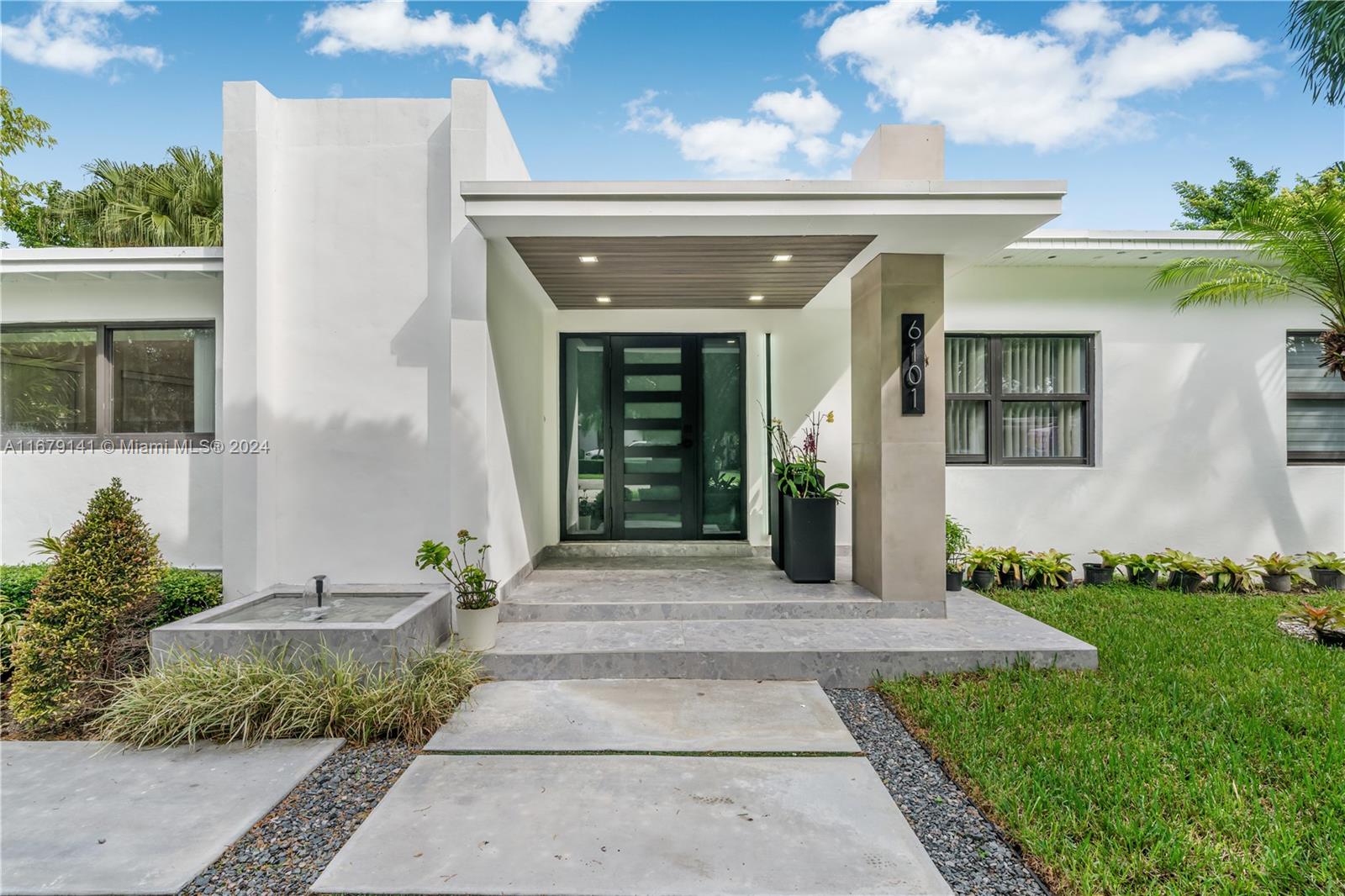 6101 Southwest 44th Terrace Miami, FL 33155 - Photo 1 of 24 a front view of a house