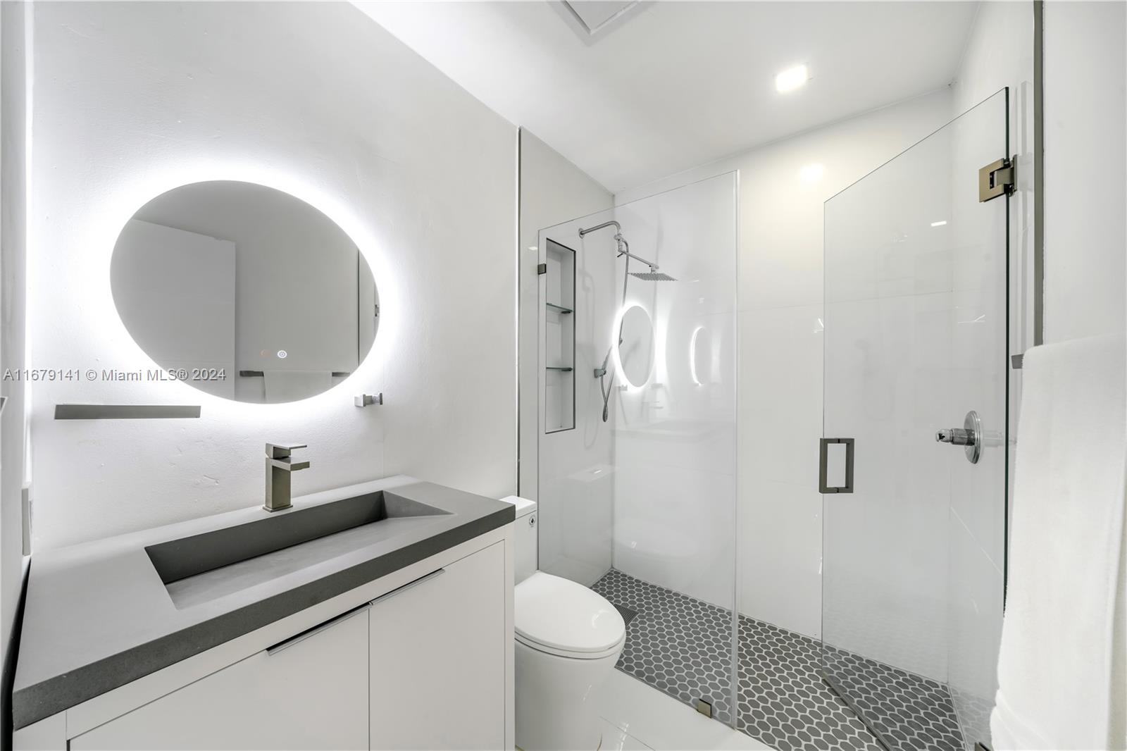 6101 Southwest 44th Terrace Miami, FL 33155 - Photo 14 of 24 a bathroom with a sink a toilet and shower