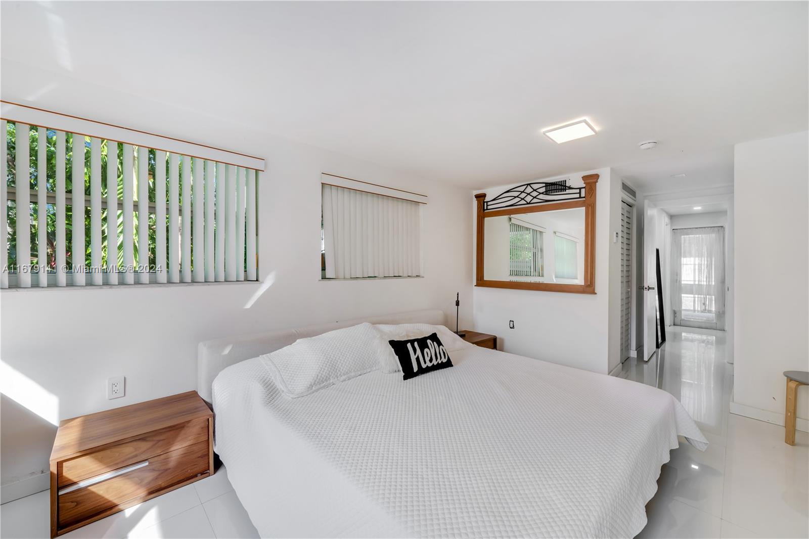 6101 Southwest 44th Terrace Miami, FL 33155 - Photo 16 of 24 a bedroom with a bed and wooden floor