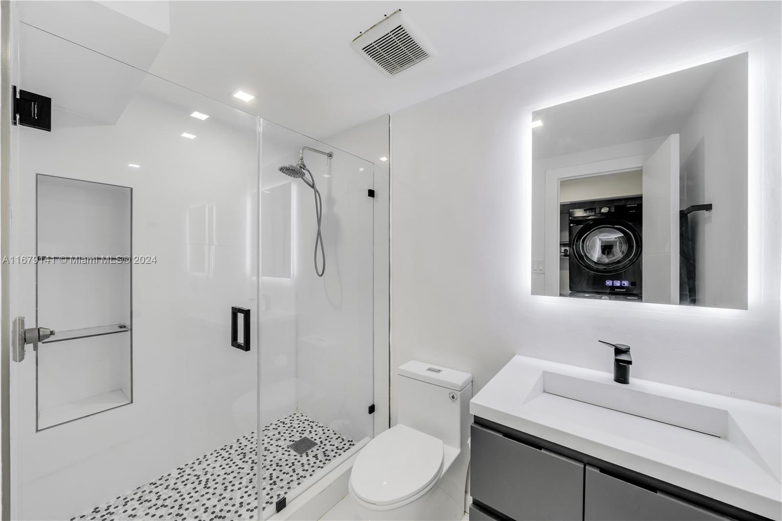 6101 Southwest 44th Terrace Miami, FL 33155 - Photo 17 of 24 a bathroom with a sink a toilet and shower