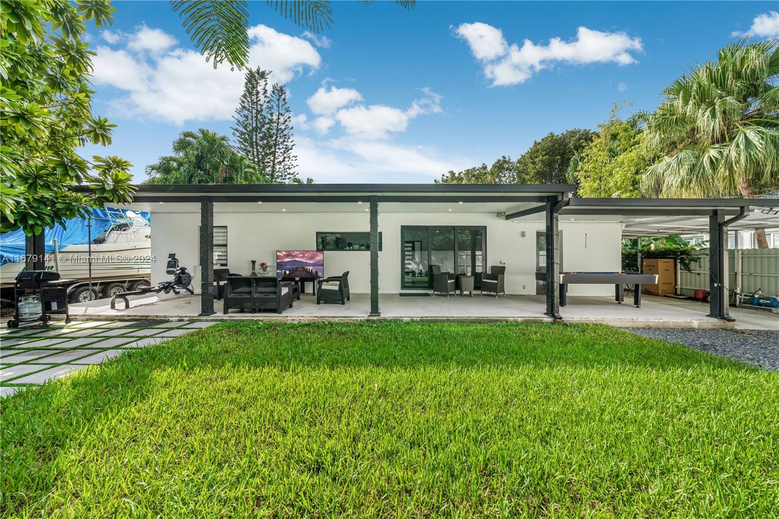 6101 Southwest 44th Terrace Miami, FL 33155 - Photo 22 of 24 a view of a backyard with a patio