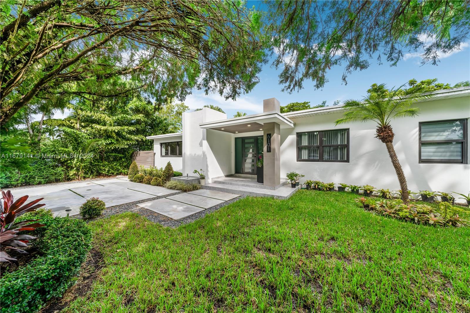 6101 Southwest 44th Terrace Miami, FL 33155 - Photo 3 of 24 a front view of a house with garden