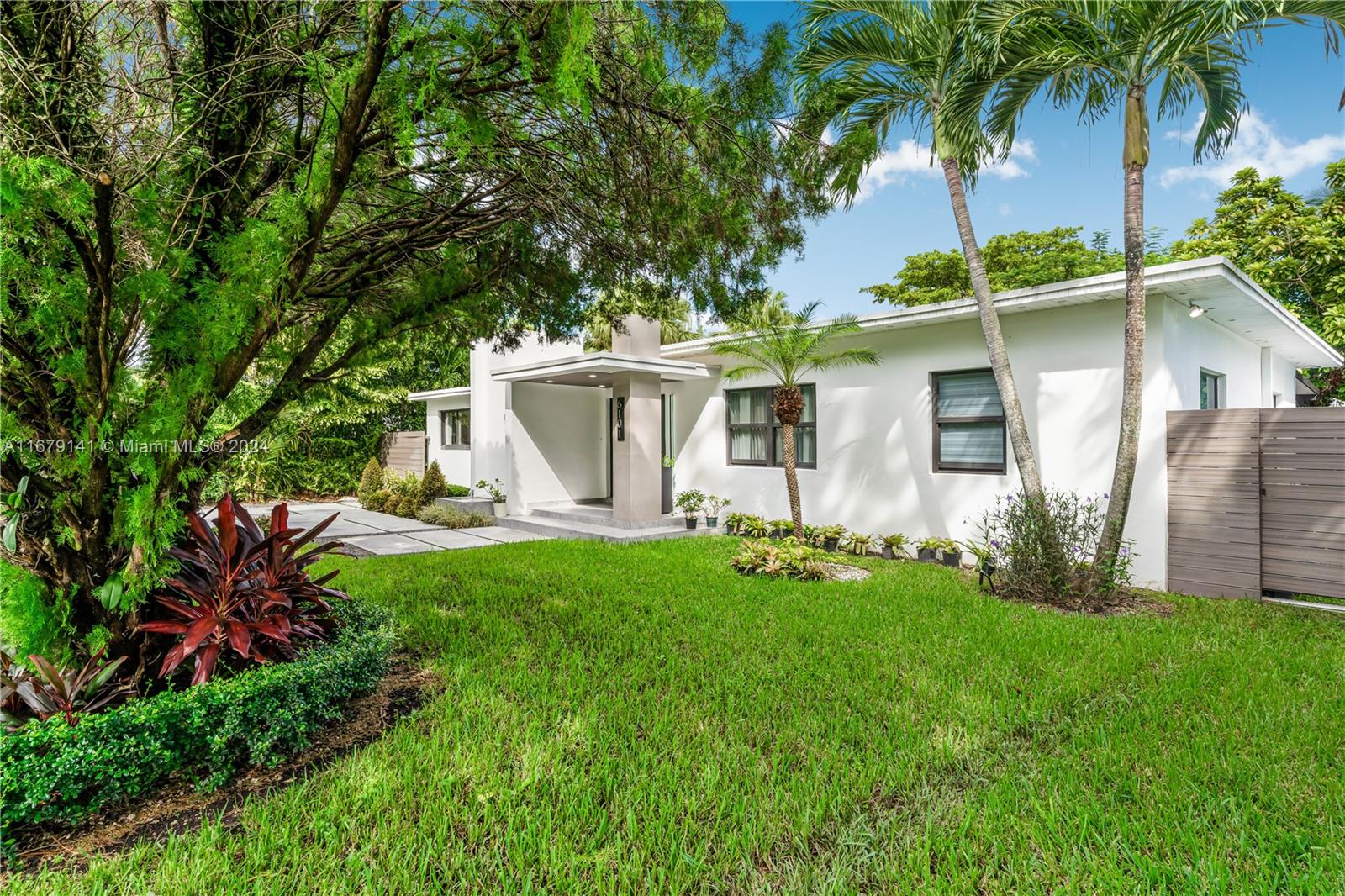 6101 Southwest 44th Terrace Miami, FL 33155 - Photo 4 of 24 a view of a house with backyard and a tree