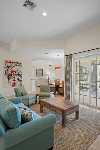 a view of a livingroom with furniture window and wooden floor