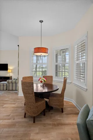 a spacious bathroom with double vanity a toilet a and a window