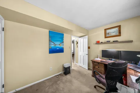 a spacious bedroom with a bed and window