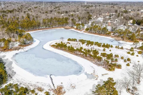 a workspace with furniture and a window