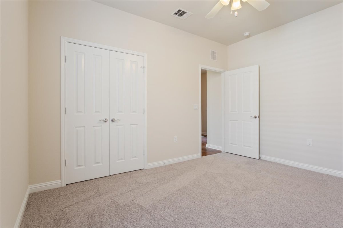 108 Cathedral Mountain Pass Georgetown, TX 78633 - Photo 28 of 36 an empty room with a ceiling fan