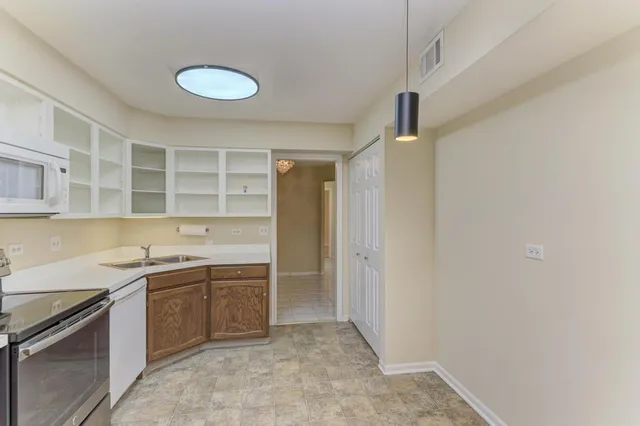a kitchen with a sink and cabinets