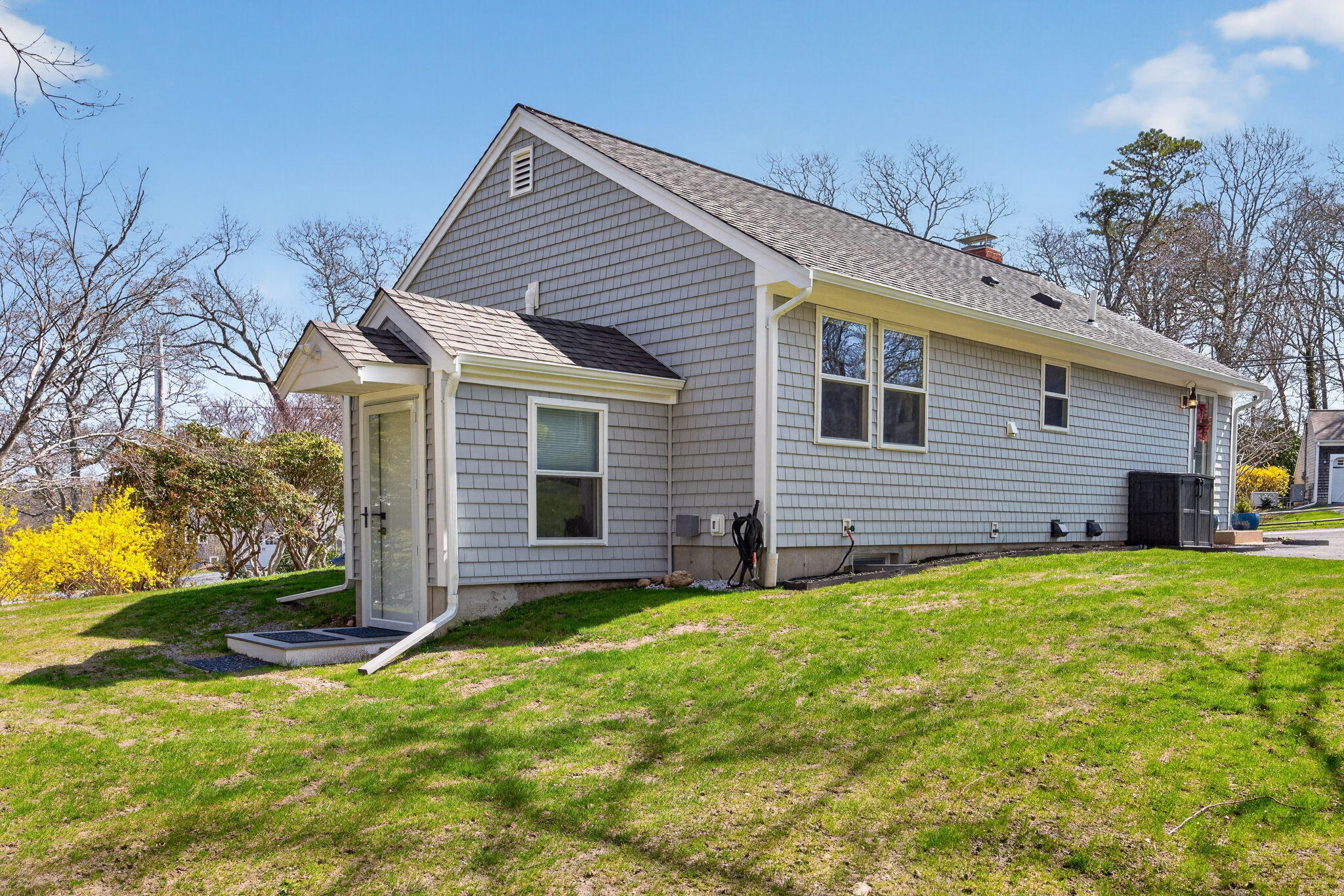 28 Chipman Road Sandwich, MA 02563 - Photo 39 of 46 a front view of house with yard and green space