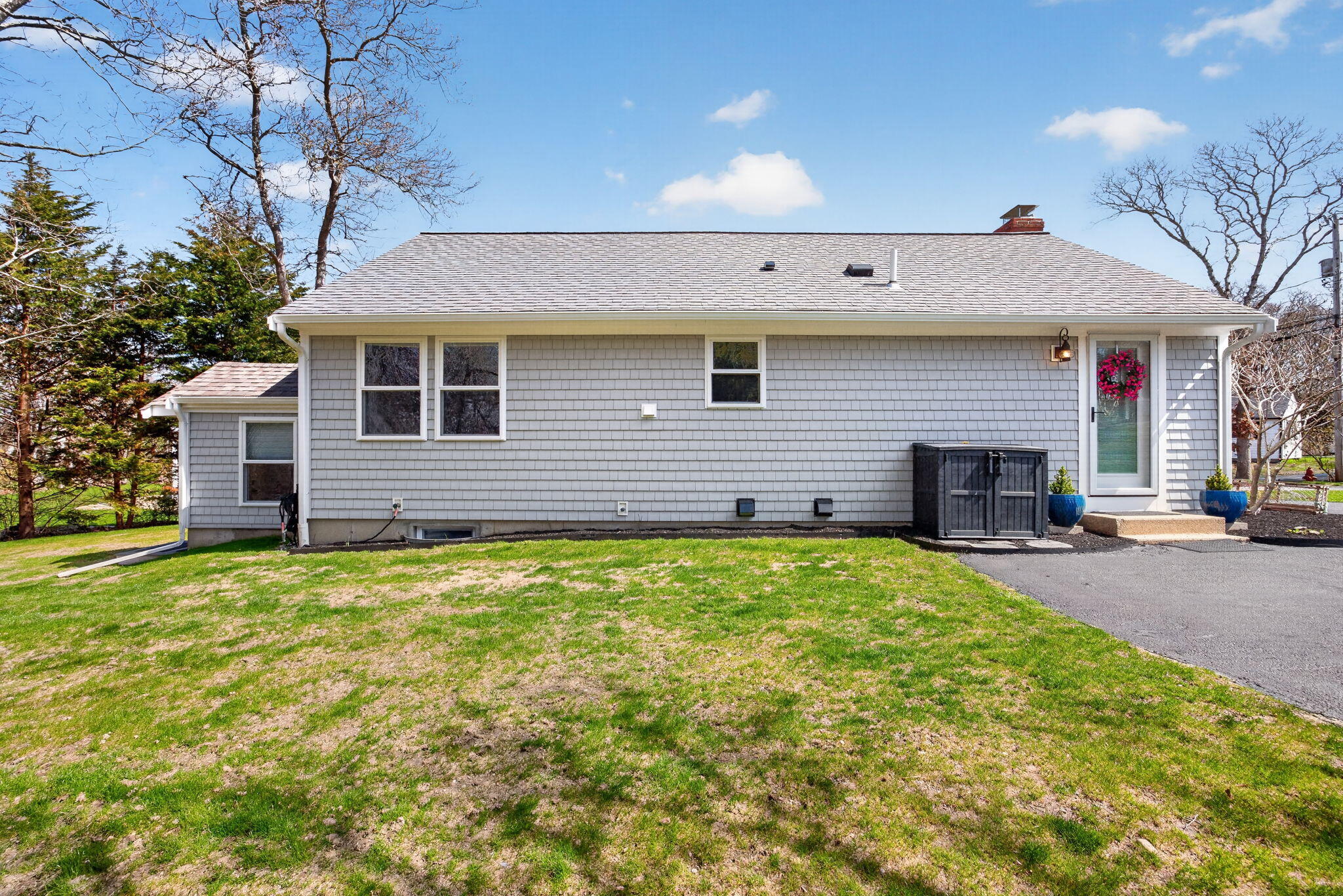 28 Chipman Road Sandwich, MA 02563 - Photo 40 of 46 a front view of a house with a garden