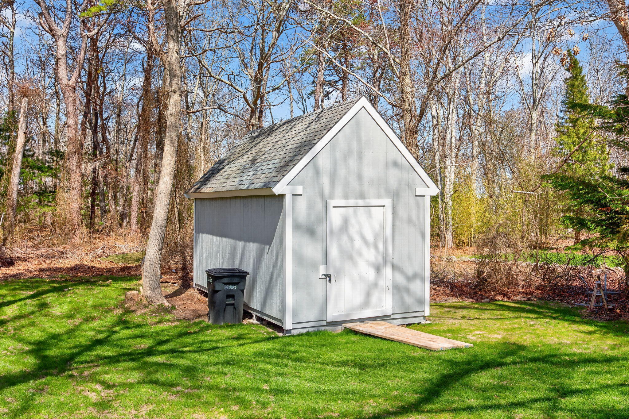 28 Chipman Road Sandwich, MA 02563 - Photo 41 of 46 a view of backyard with a barn and a large tree