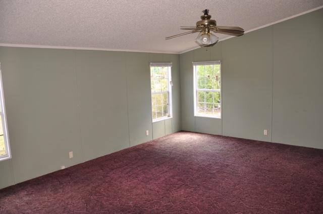 72 Arbour Street DeFuniak Springs, FL 32433 - Photo 11 of 13 a view of an empty room with a window
