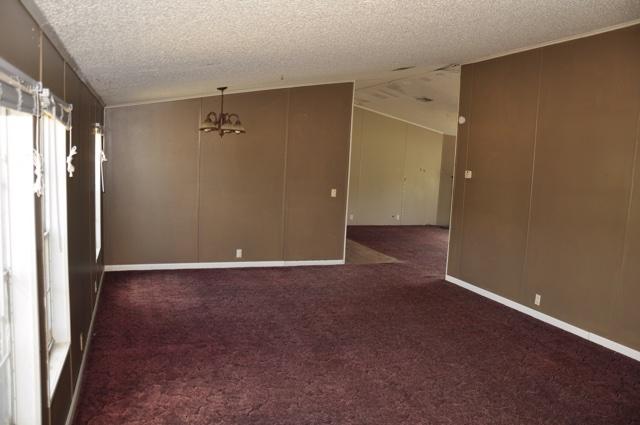 72 Arbour Street DeFuniak Springs, FL 32433 - Photo 2 of 13 an empty room with closet and windows