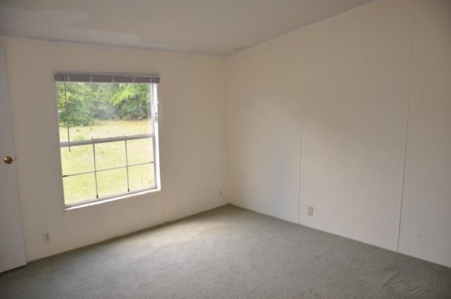 72 Arbour Street DeFuniak Springs, FL 32433 - Photo 10 of 13 an empty room with a window
