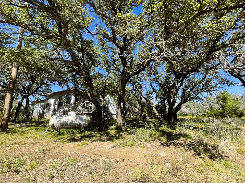 1276 Fm 574 Street West Mullin, TX 76864 - Photo 34 of 40 a view of a yard with large trees