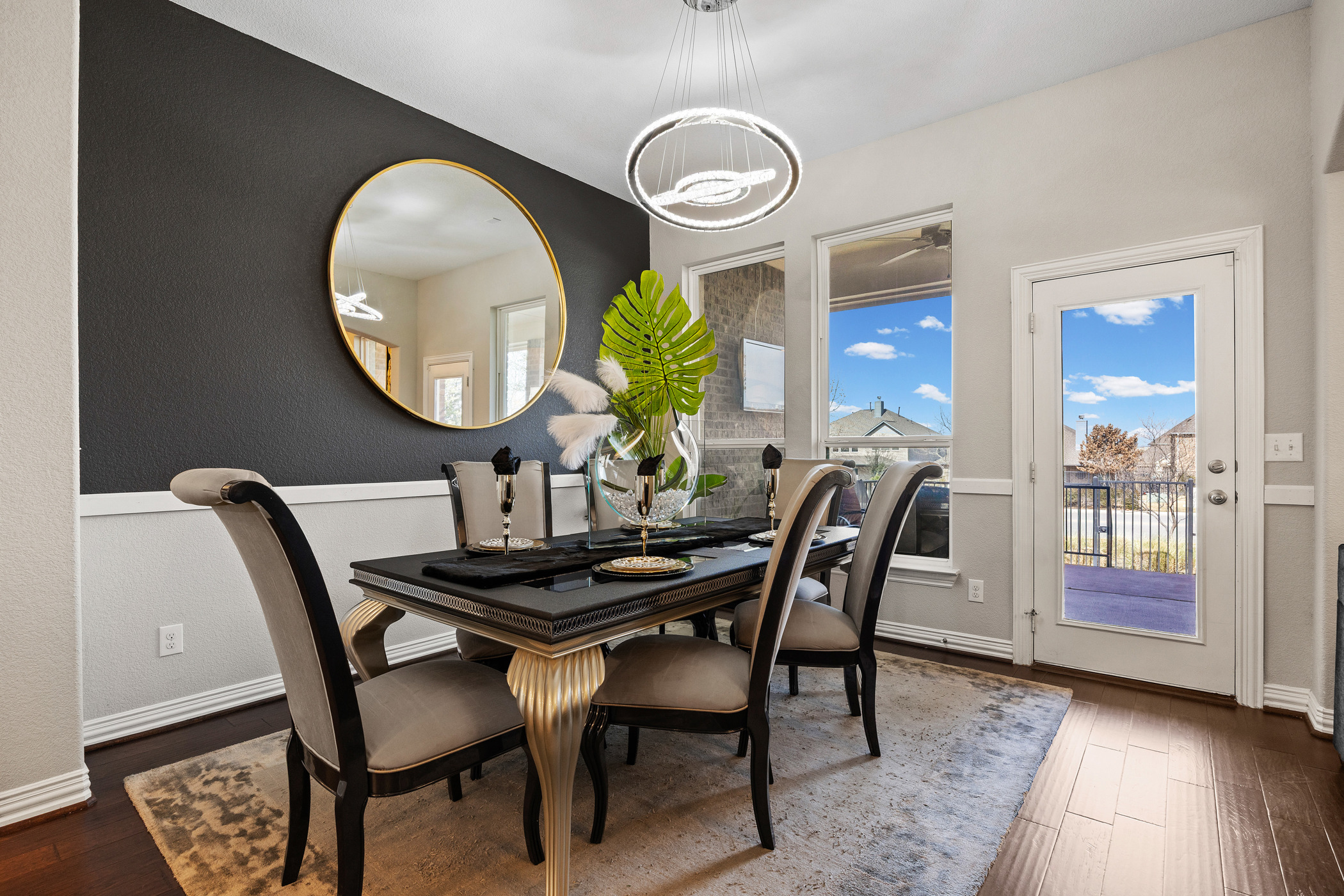 381 Betony Loop Buda, TX 78610 - Photo 12 of 32 a dining room with furniture and wooden floor