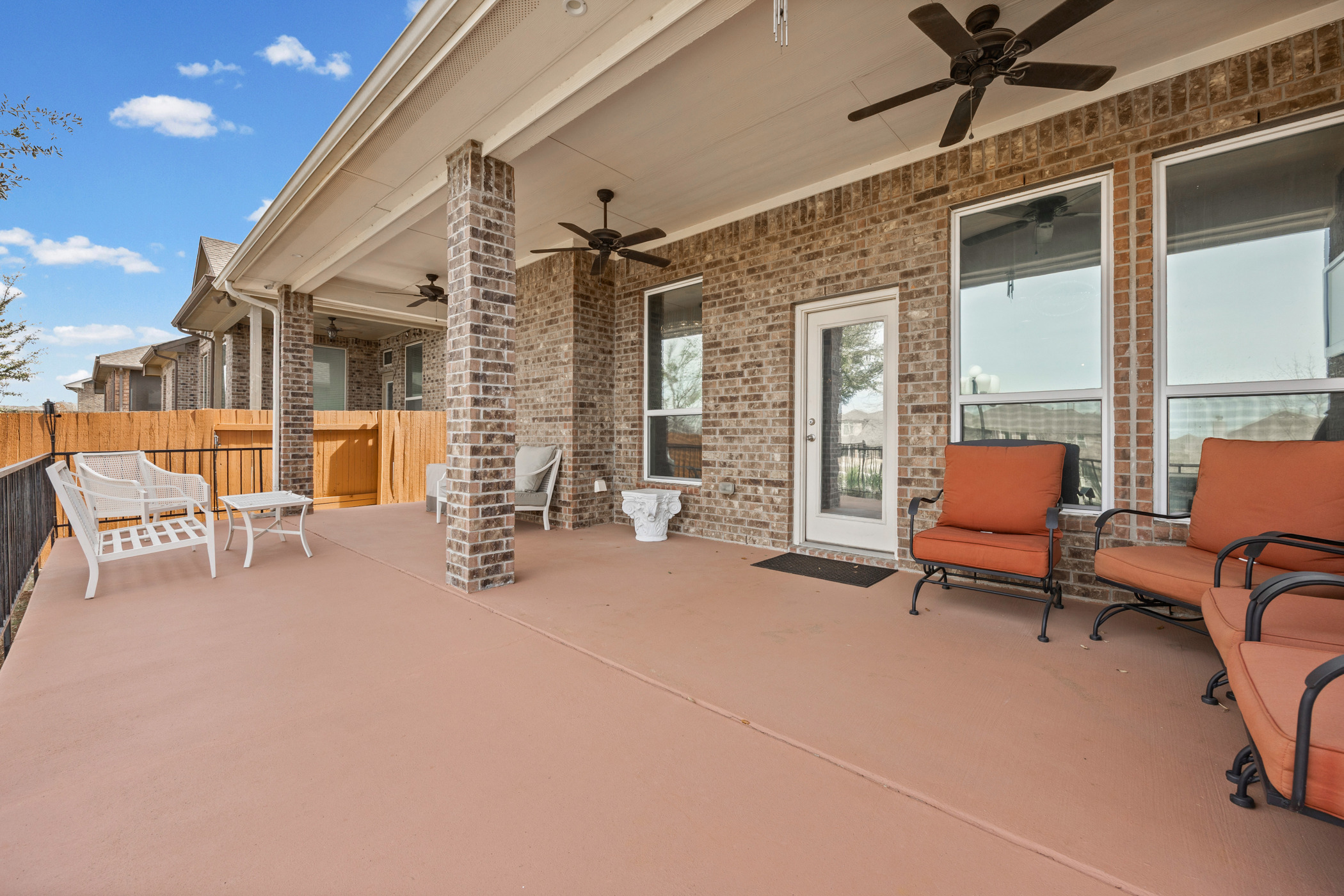 381 Betony Loop Buda, TX 78610 - Photo 16 of 32 a outdoor space with patio furniture and a ceiling fan