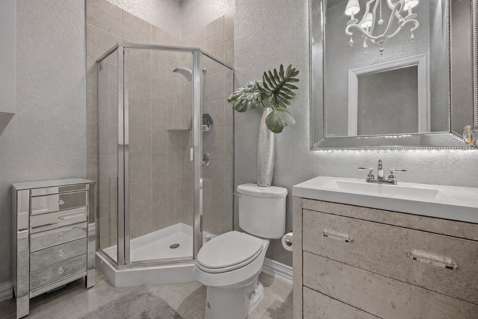 381 Betony Loop Buda, TX 78610 - Photo 22 of 32 a bathroom with a toilet a sink and shower