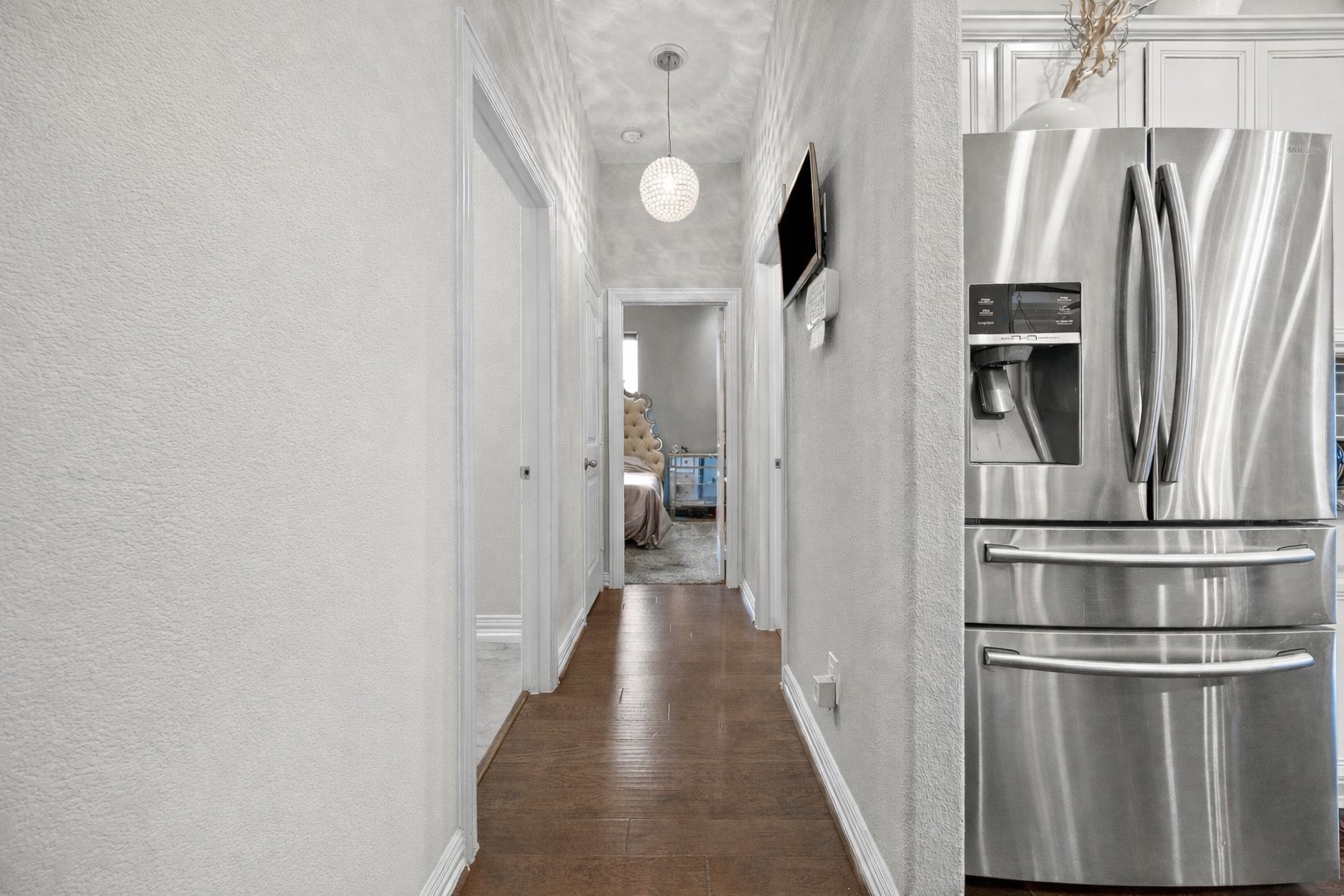 381 Betony Loop Buda, TX 78610 - Photo 23 of 32 a view of a kitchen from the hallway