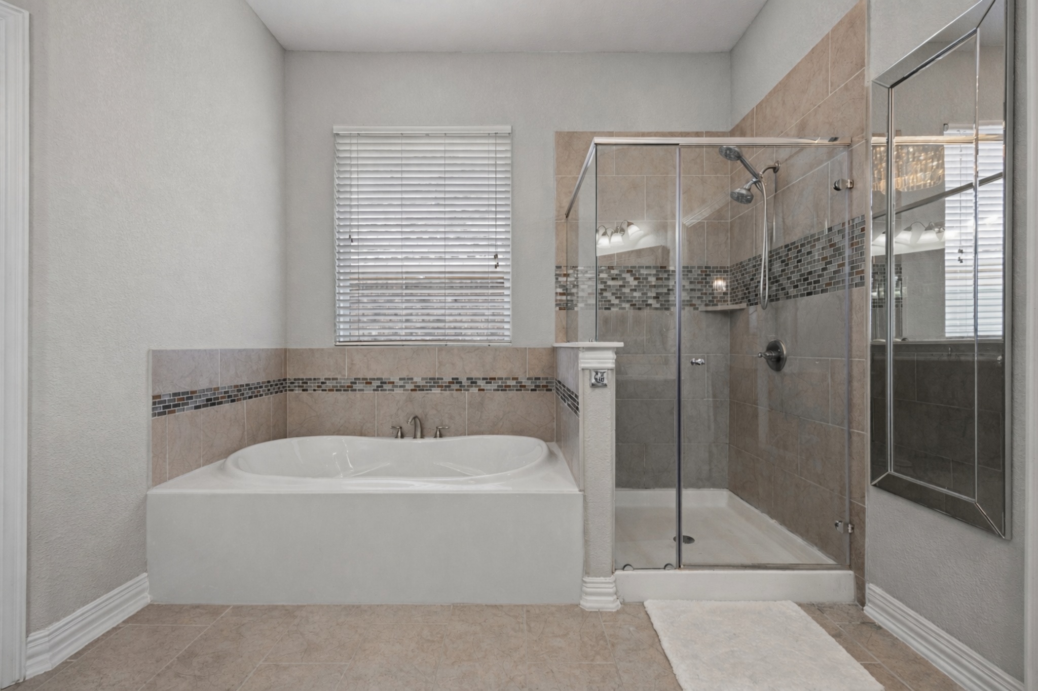 381 Betony Loop Buda, TX 78610 - Photo 31 of 32 a bathroom with a bath tub and shower