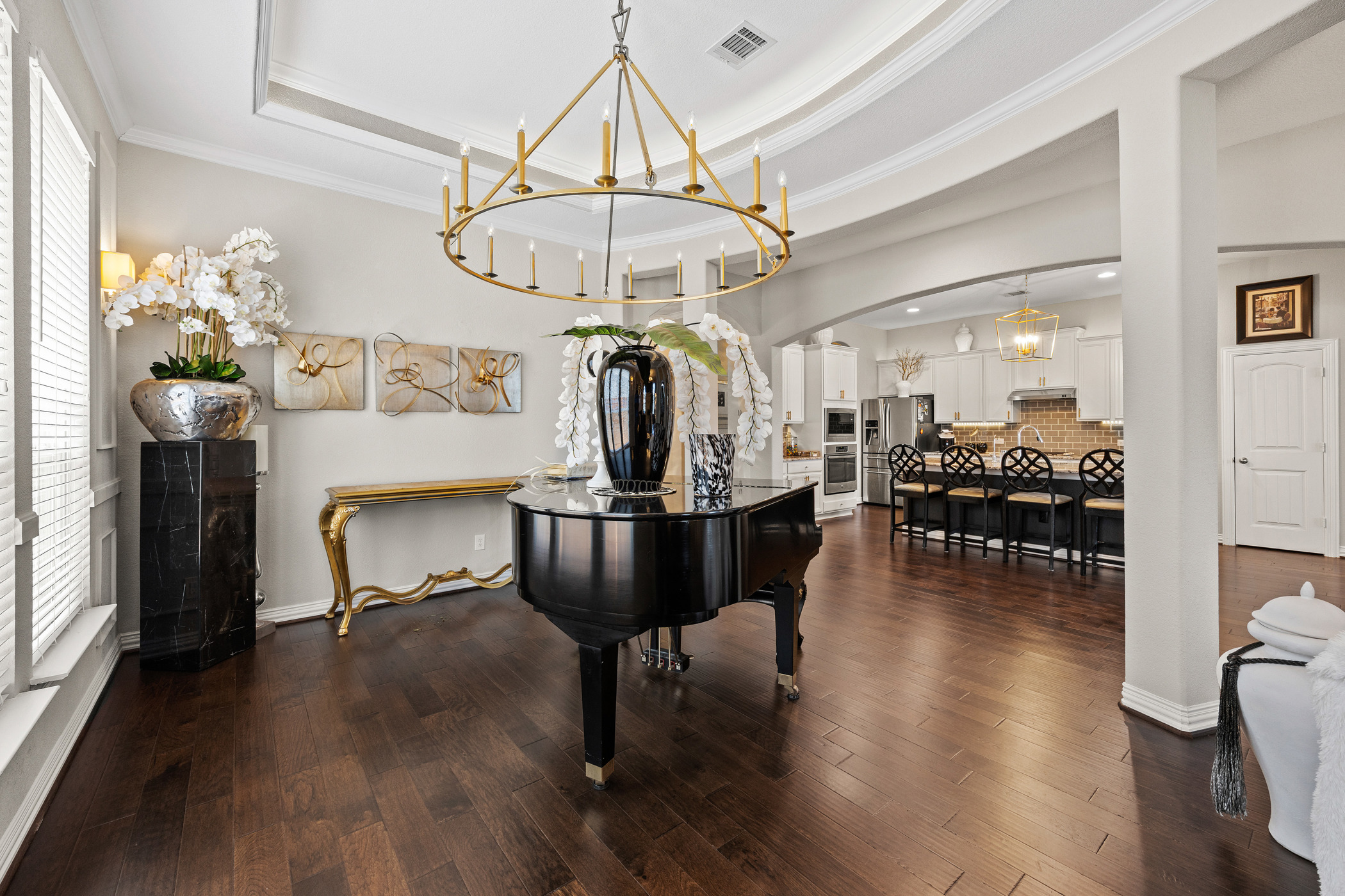 381 Betony Loop Buda, TX 78610 - Photo 8 of 32 a view of a dining room with furniture and wooden floor