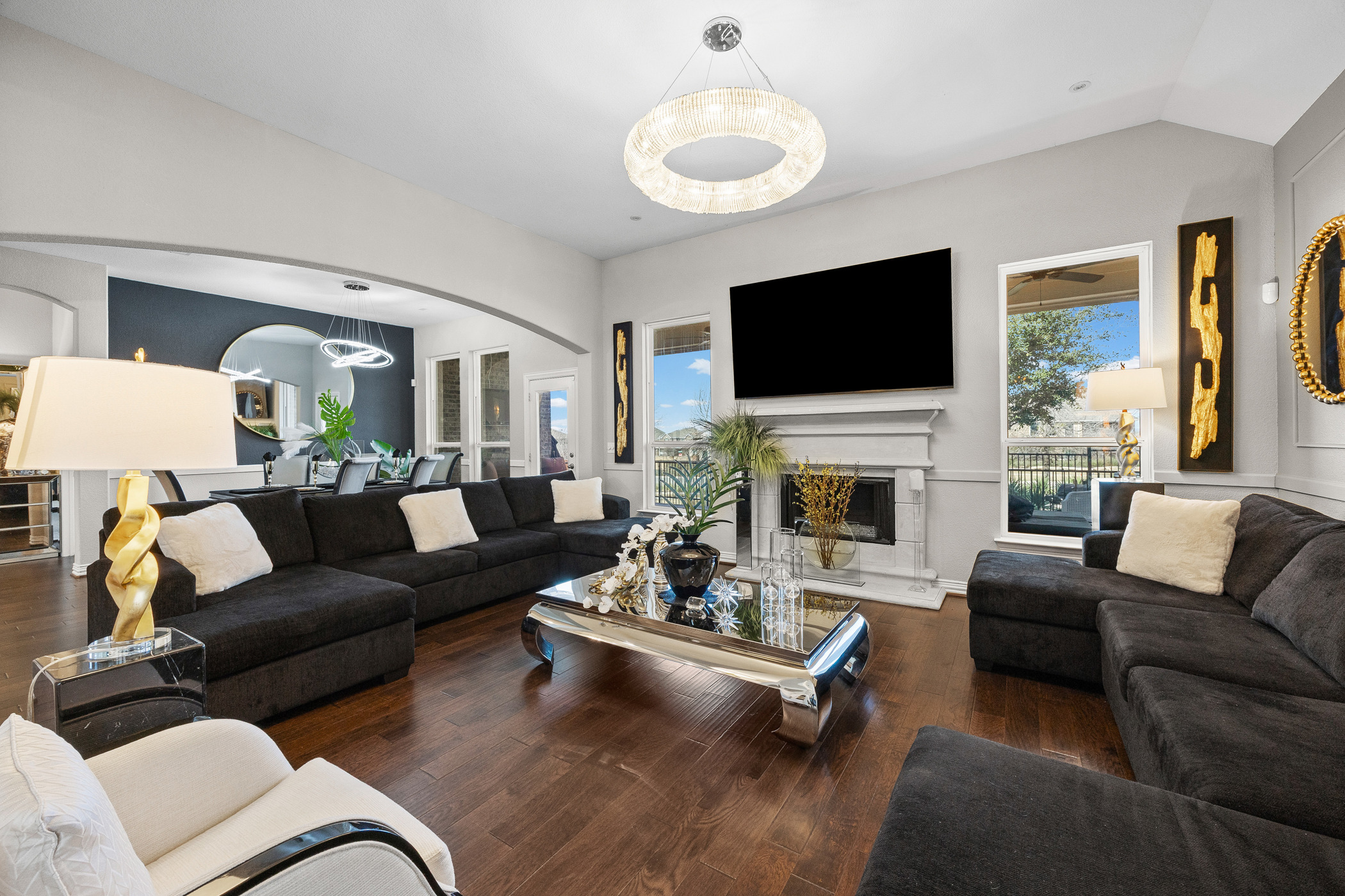 381 Betony Loop Buda, TX 78610 - Photo 9 of 32 a living room with furniture fireplace and a flat screen tv