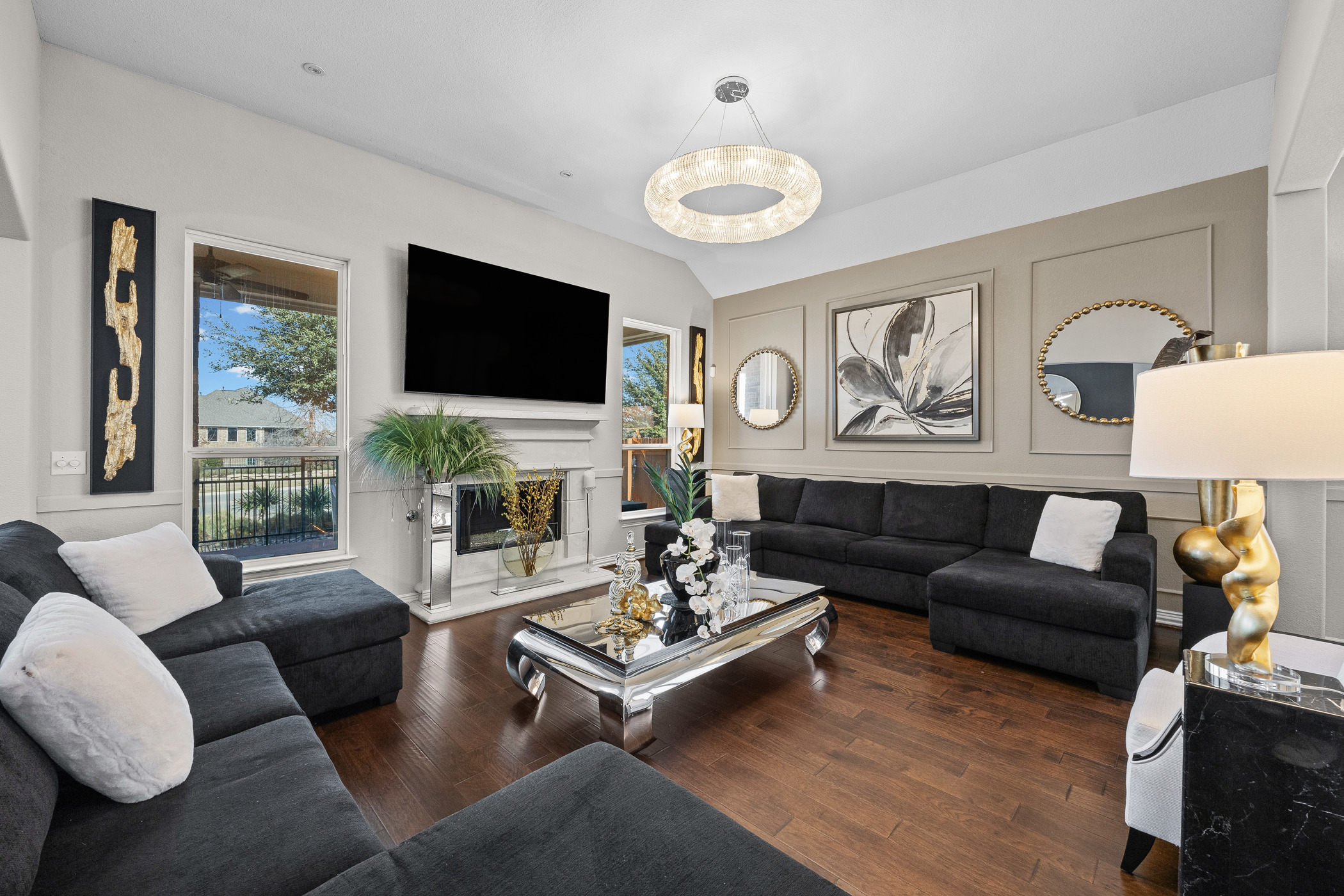 381 Betony Loop Buda, TX 78610 - Photo 10 of 32 a living room with furniture fireplace and a flat screen tv