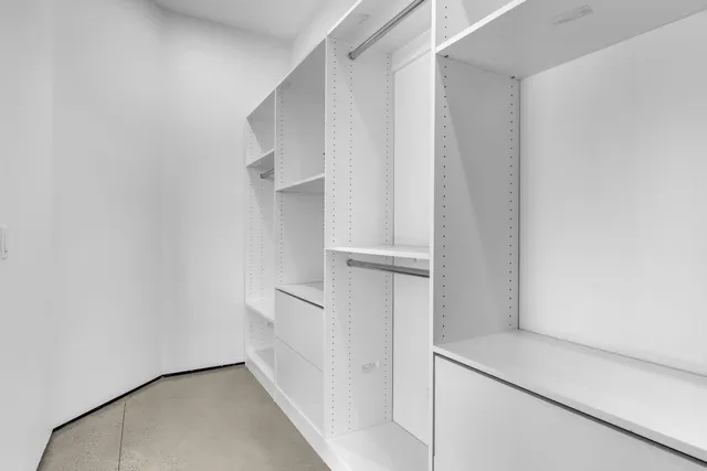 a bathroom with a toilet sink and shower