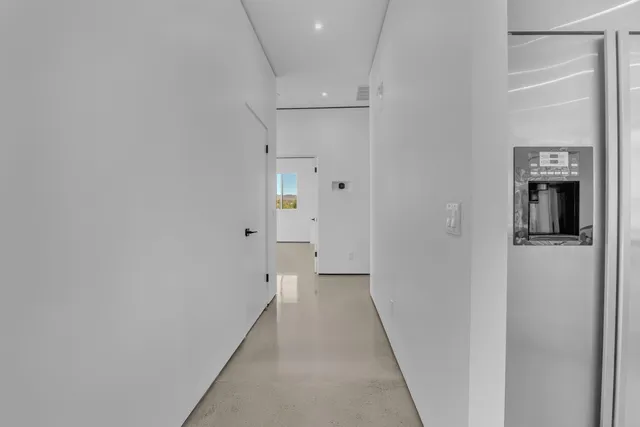 a kitchen with stainless steel appliances a refrigerator sink and stove