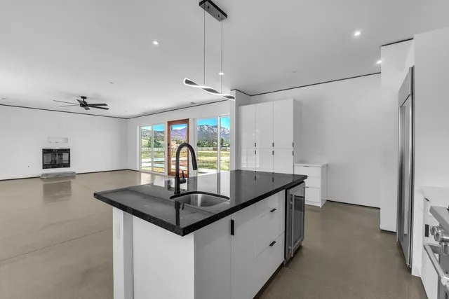 a kitchen with a refrigerator sink and stove