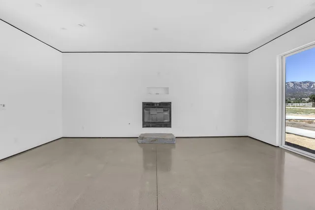a view of a kitchen with furniture and a ceiling fan