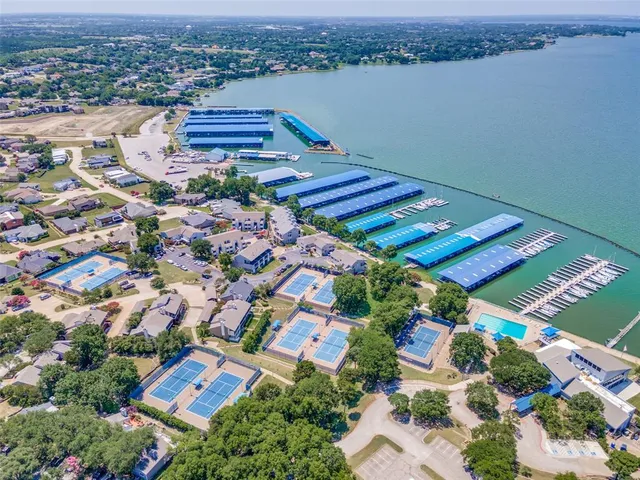 a view of a swimming pool with a patio and a yard